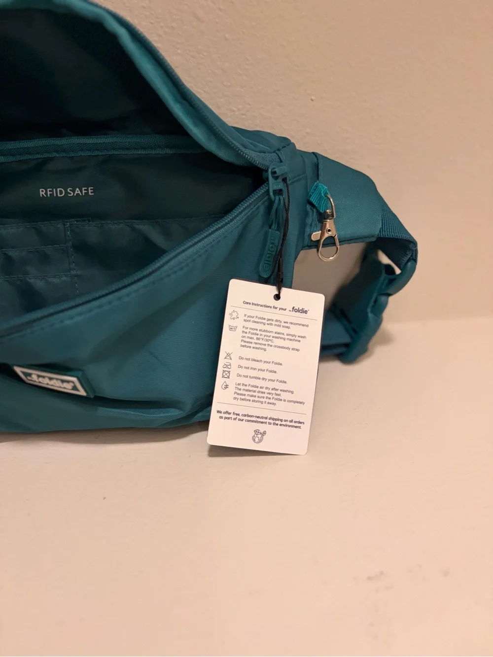 The Foldie Teal Waist Crossbody Bag RFID Blocking Travel Hand Free NWT